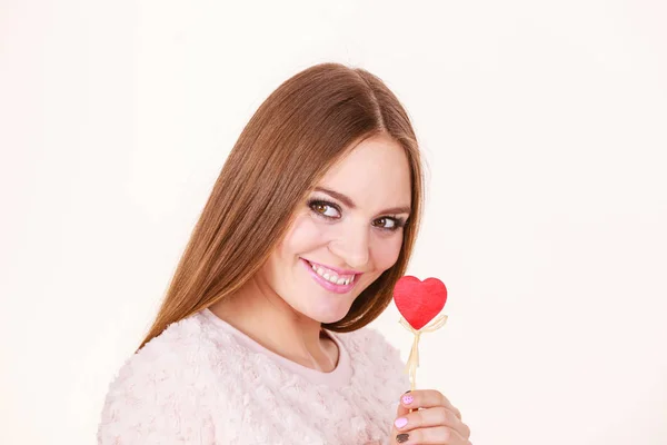 Beautiful woman holding heart shaped hand stick — Stock Photo, Image