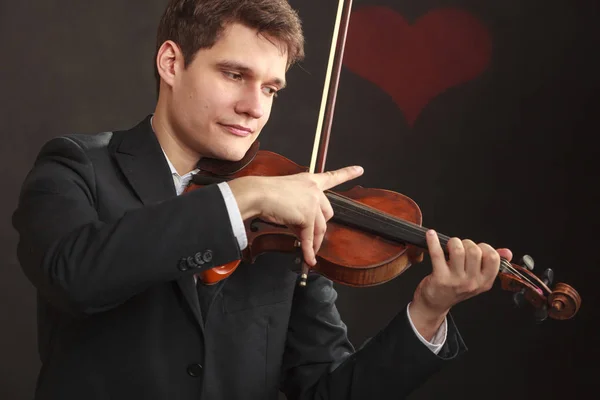 Hombre hombre vestido elegantemente tocando el violín — Foto de Stock