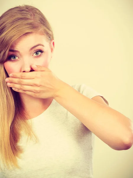 Ashamed woman having hand on mouth — Stock Photo, Image