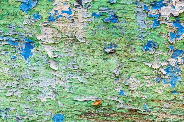Закрытие пятен краски на деревянной доске — стоковое фото