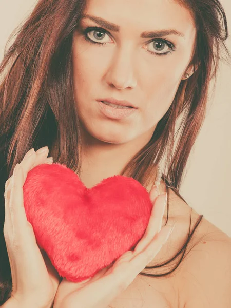 Woman holds red heart love symbol — Stock Photo, Image