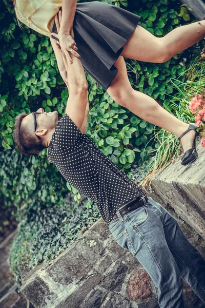 Girl falling caught by boyfriend. — Stock Photo, Image