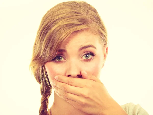 Sad woman covering mouth with hand — Stock Photo, Image