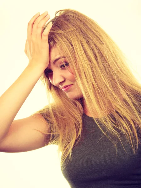 Ashamed embarrassed blonde woman with hand on face — Stock Photo, Image
