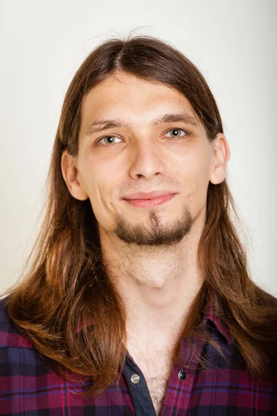 Smiling guy with long hairs. — Stock Photo, Image