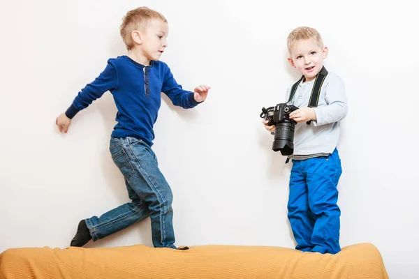 Little boys play with camera. — Stock Photo, Image