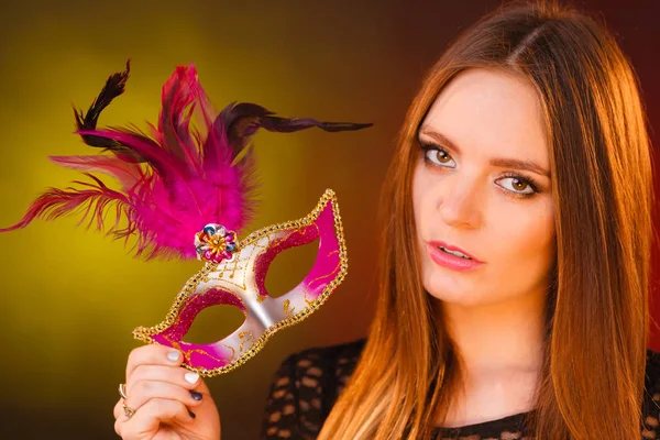 Woman holds carnival mask closeup — Stock Photo, Image