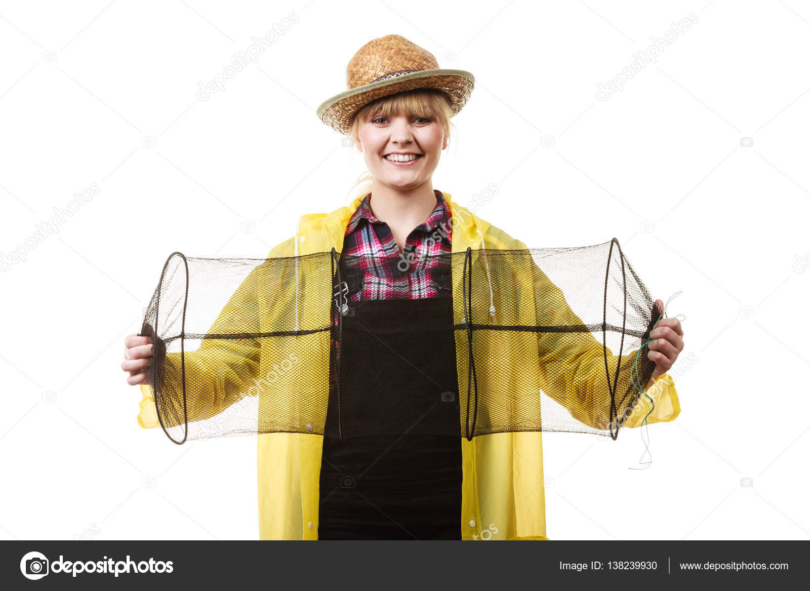 Happy woman holding empty fishing keepnet Stock Photo by