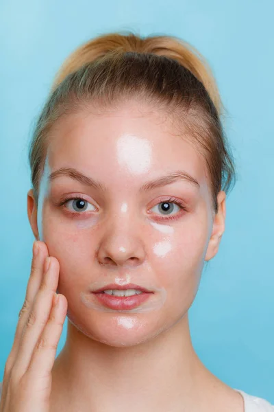 Woman in facial peel off mask. — Stock Photo, Image
