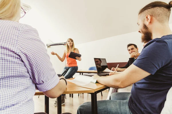Students and teacher in classroom — Stock Photo, Image
