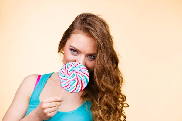 Woman joyful girl with lollipop candy — Stock Photo, Image