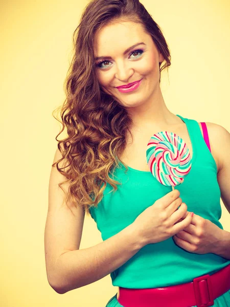 Woman charming girl with lollipop candy — Stock Photo, Image