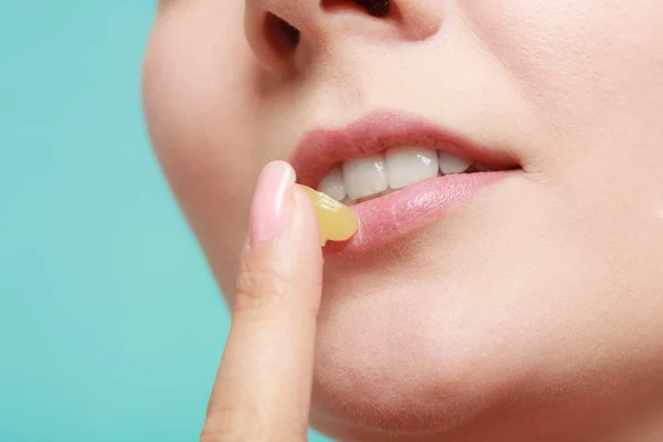 Woman applying balsam for lips — Stock Photo, Image