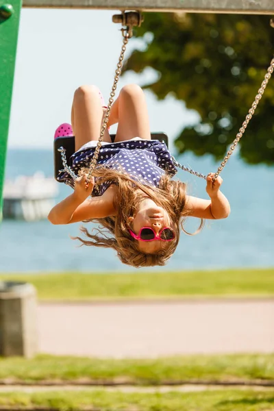 Playful crazy girl on swing. — Stock Photo, Image