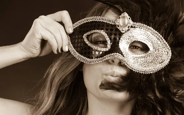 Closeup woman face with carnival mask on dark — Stock Photo, Image