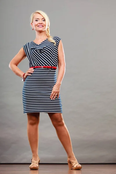 Mid adult woman in summer striped dress — Stock Photo, Image