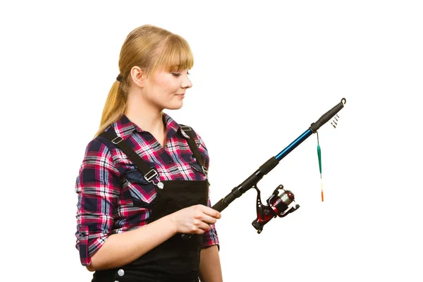 Similing woman wearing check shirt holding fishing rod — Stock Photo, Image