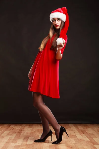 Woman wearing santa claus hat on black — Stock Photo, Image