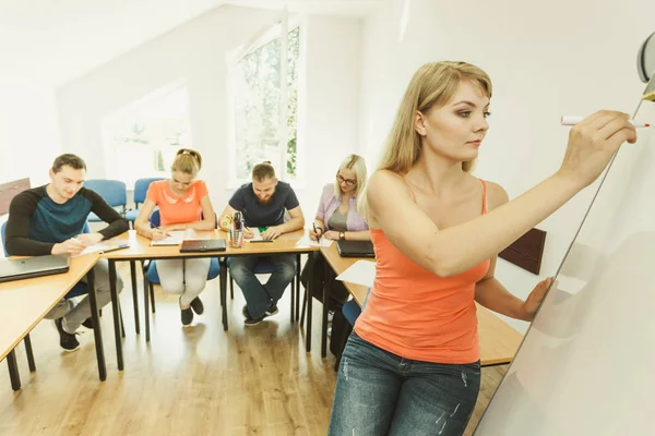Students and teacher in classroom — Stock Photo, Image