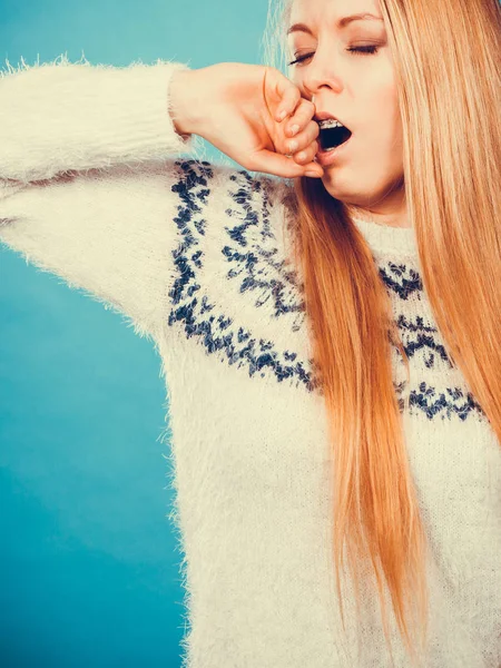 Sleepy yawning teenage woman in jumper — Stock Photo, Image