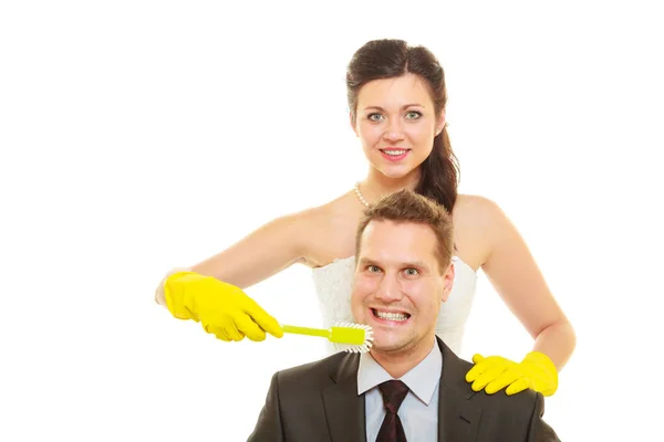 Bride and groom sharing household duties — Stock Photo, Image