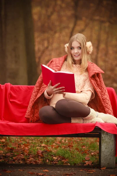 Blonde girl with red book. — Stock Photo, Image