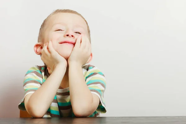 Kid making funny faces being bored — Stock Photo, Image