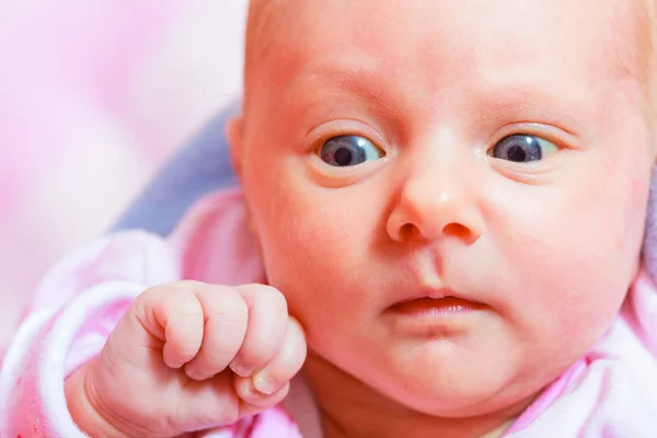 Newborn baby lying in pyjamas and towel — Stock Photo, Image