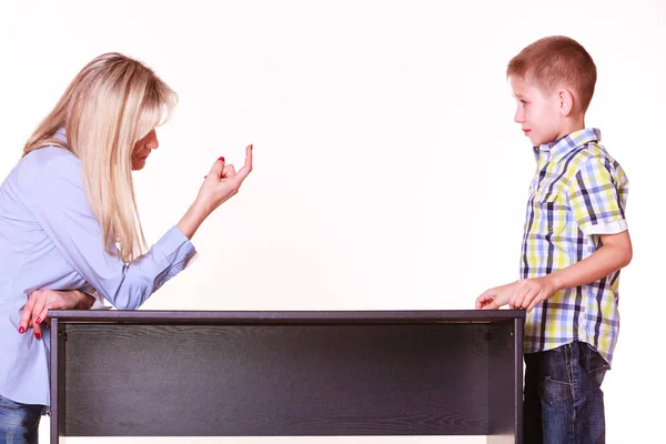 Mother and son talk and argue sit at table. — Stock Photo, Image