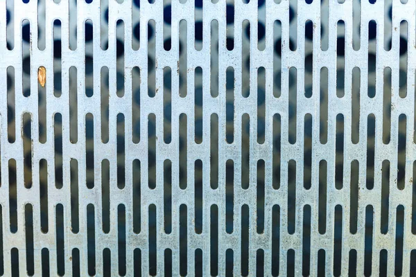 Abstract closeup of steel texture with holes — Stock Photo, Image