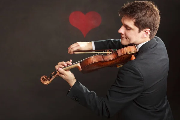 Hombre hombre vestido elegantemente tocando el violín — Foto de Stock