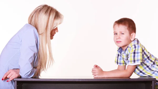 Mother and son talk and argue sit at table. — Stock Photo, Image