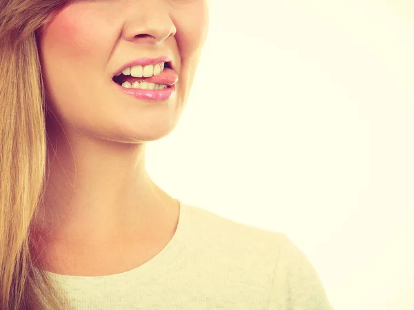 Funny blonde woman sitcking tongue out — Stock Photo, Image