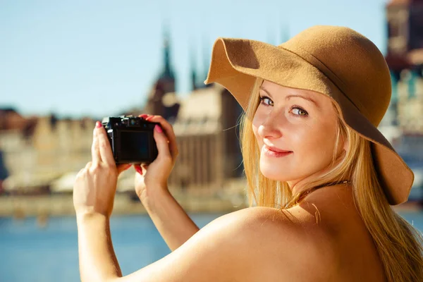 Beautiful elegant woman caught on taking pictures — Stock Photo, Image