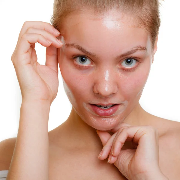 Woman in facial peel off mask. — Stock Photo, Image