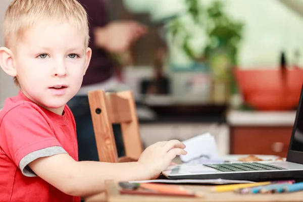 Little boy with laptop on table in home. — Stock Photo, Image