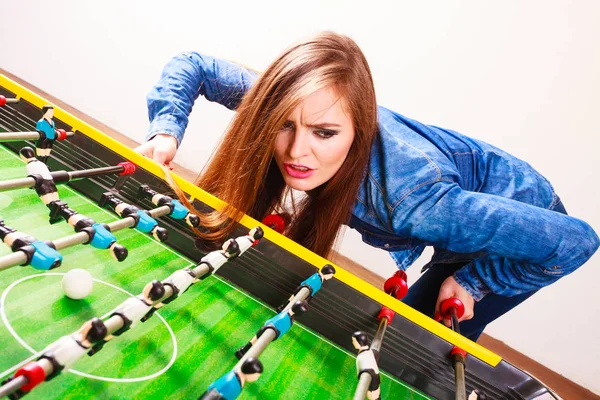 Woman playing table football game — Stock Photo, Image