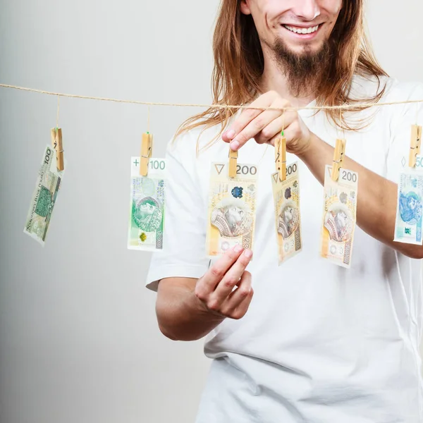 Rich man with laundry of money — Stock Photo, Image