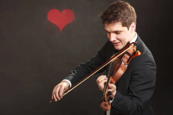 Hombre hombre vestido elegantemente tocando el violín — Foto de Stock