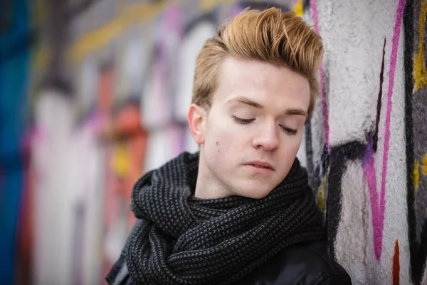 Fashion male portrait on graffiti wall — Stock Photo, Image