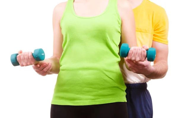 Couple exercising with dumbbells lifting weights — Stock Photo, Image