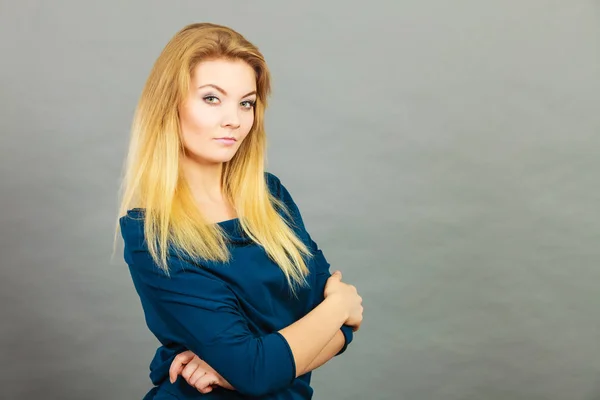 Portrait blonde young woman having serious face expression — Stock Photo, Image