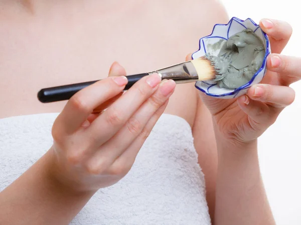 Woman mixing face mask in little porcelain bowl — Stock Photo, Image