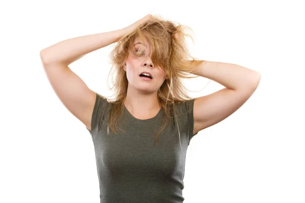 Crazy, mad blonde woman with messy hair Stock Image