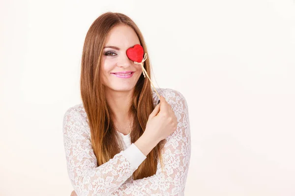 Beautiful woman holding heart shaped hand stick — Stock Photo, Image