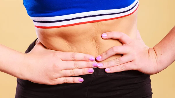 Fit woman suffering from stomach pain — Stock Photo, Image