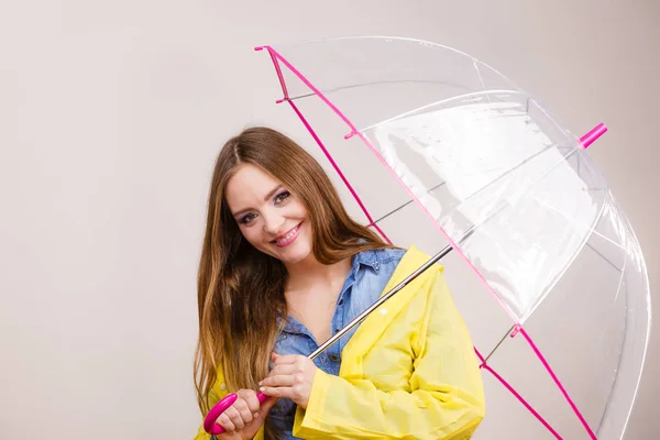 Woman wearing waterproof coat under umbrella — Stock Photo, Image