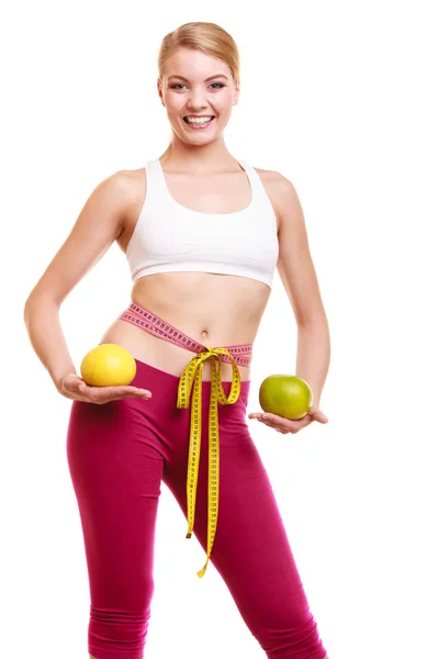 Smiling woman with grapefruits measuring tape. — Stock Photo, Image