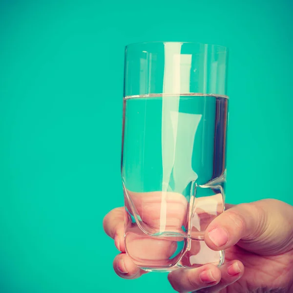 Person holding a glass of water — Stock Photo, Image