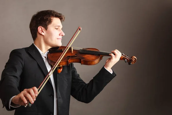 Muž muž oblečený elegantně hrát na housle — Stock fotografie